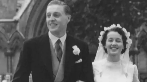 Black and white picture of mr and mrs Palmer on their wedding day