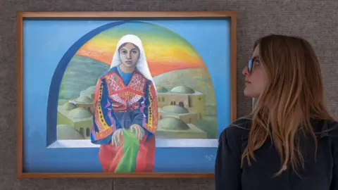 Alamy A painting by Sliman Mansour, Woman From Bethlehem, at Bonhams Modern and Contemporary Middle Eastern Art, in London, UK (24 November 2025)