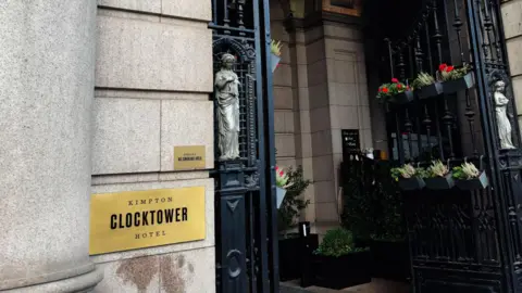 Getty Images Grand entrance of Kimpton Clocktower Hotel in Manchester with intricate iron gates 