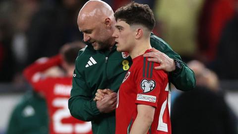 Rob Page consoles Daniel James after his penalty miss against Poland