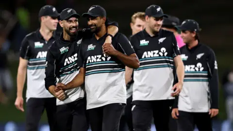 New Zealand's Daryl Mitchell and Ish Sodhi celebrate beating Pakistan