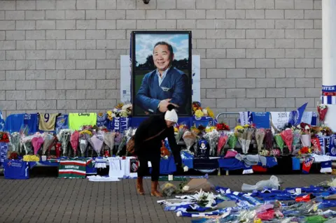 Reuters A woman places flowers outside Leicester City's King Power stadium, after the club's owner Thai businessman Vichai Srivaddhanaprabha and four other people died when the helicopter they were travelling in crashed as it left the ground after the match on Saturday, in Leicester, Britain, October 29, 2018
