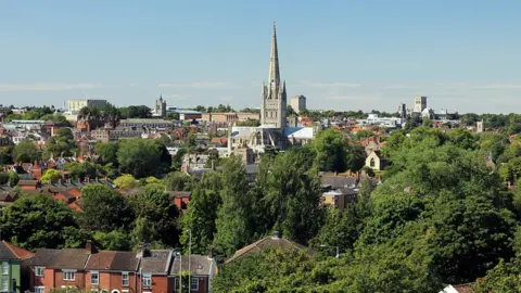 Getty Images Elevated view of Norwich with the city's cathedral in the background