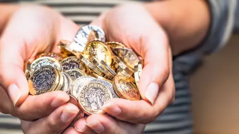 Getty Images handful of pound coins