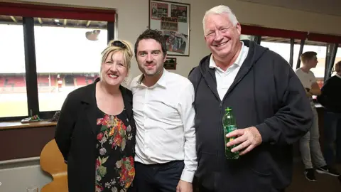 Getty Images George Gilbey, Linda Gilbey and Pete McGarry standing together