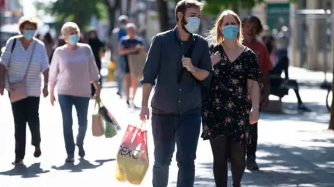 Getty Images Shoppers out in Newport on Monday