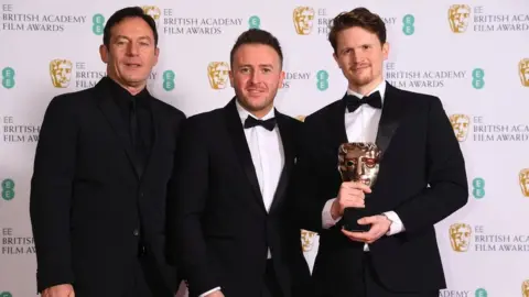 Getty Images Jason Isaacs with Oliver Walton and Alex Lockwood