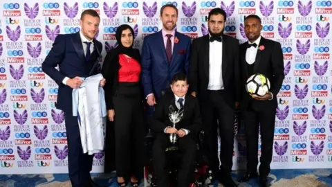 PA Gareth Southgate (centre back), Jermaine Defoe (right), and Jamie Vardy present Moin Younis the Child/Teenager of Courage award