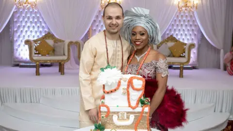 Tino Antoniou Horia and Assumpta in Nigerian dress