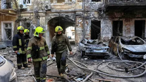 Emergency workers at the scene of an attack in Odesa on 9 August