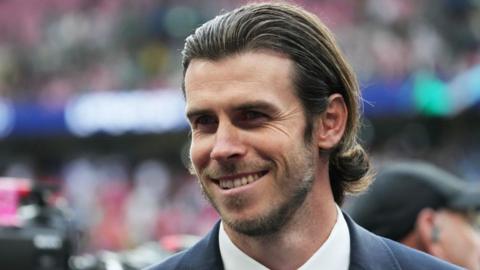 Former Wales forward Gareth Bale smiles