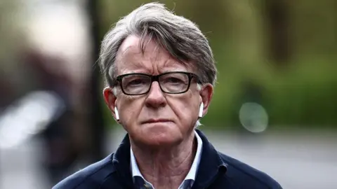 Former UK ambassador to the United States, Lord Peter Mandelson, is pictured as he walks his dog near his residence in central London on April 20, 2026