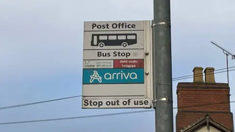 BBC A disused bus stop sign on a lamppost