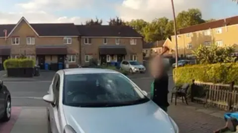 Supplied Doorbell footage of Melissa's car being hit with a hammer