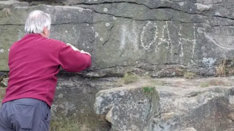 Peak District National Park The name Noah being removed from the cave