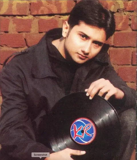 Instagram/Y Yo Honey Singh Picure of Y Yo Honey Singh from 2003 wearing a black jacket and a black jacket with a tablet 