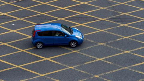 A car in a yellow box junction