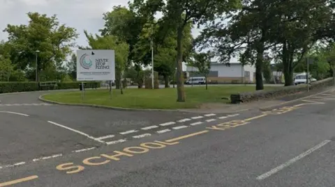 Google A secondary school entrance and road