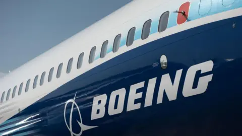 The Boeing logo is seen on the side of a Boeing 737 MAX during the Farnborough International Airshow 2022 on July 18, 2022 in Farnborough, England.