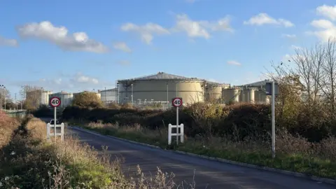 Eric Johnson/BBC A general view of the Buncefield site in Hemel Hempstead, taken on a sunny day in November 2025.
