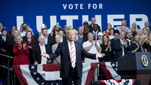 AFP/Getty Images US President Donald Trump pictured during a rally for Alabama state Republican Senator Luther Strange on 22 September, 2017 in Huntsville, Alabama