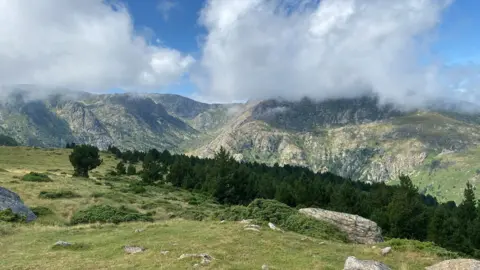 Family handout Pyrenees mountains and clouds