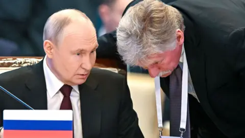 EPA Russian President Vladimir Putin and Kremlin spokesman Dmitry Peskov