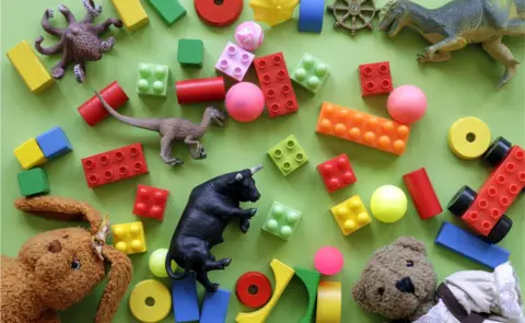 Getty Images General image of children's toys, including toy dinosaurs, balls, building blocks and a teddy