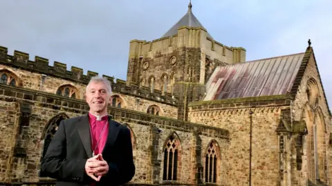 Church in Wales The Most Rev Andrew John outside Bangor cathedral