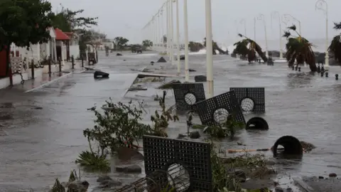 Reuters Debris on a flooded seafront after Hurricane Maria in Basse-Terre, Guadeloupe.