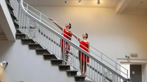 NAPA Two ballet dancers on a stair case