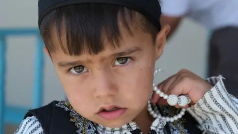 Kate Green Young boy refugee