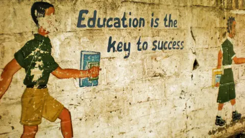 Getty Images Painting on school wall in Senegal