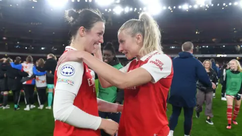 Lotte Wubben-Moy and Leah Williamson celebrate