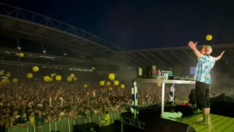 Getty Images Fatboy Slim performing at the Amex stadium in 2012