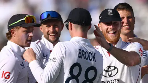 England players celebrate a wicket