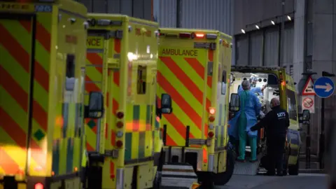 Ambulances queue outside a hospital during the Covid pandemic