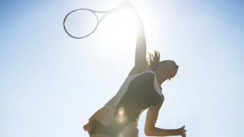 Getty Images Woman playing tennis