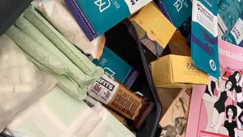 Rachael Mutch Picture of the bag contents - including pads, tampons and snack bars