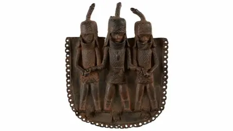 A square bronze pendant or ornament, one of the objects that London's Horniman Museum says was looted from Benin City by British soldiers in 1897