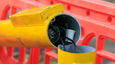 A close up of the damage to a speed camera on Errwood Road 