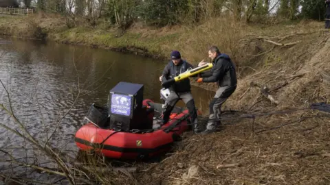 PA Media Divers load equipment on to a boat