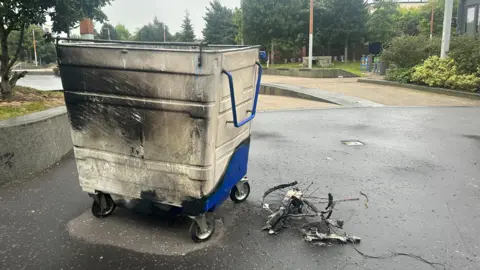 A burnt out bin