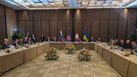 Rustem Umerov/Telegram A photo by Ukraine's National Security Council Secretary Rustem Umerov shows negotiators from Ukraine (right), Russia (left) and the US (centre) in Geneva. Photo: 17 February 2026