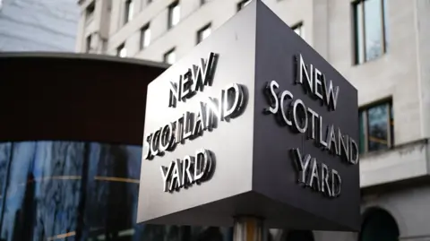 Large cube sign of New Scotland Yard outside the Met HQ