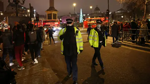 Reuters Police officers patrol during an anti-lockdown protest and a New Year"s celebration, amid the outbreak of the coronavirus disease (COVID-19), in London, Britain January 1, 2021