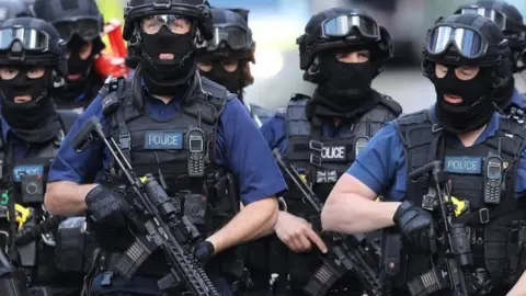 Getty Images Counter-terrorism officers near the scene of the attacks at London Bridge