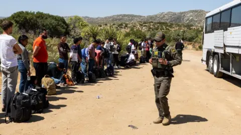 Getty Images Undocumented migrants are being processed north of the US-Mexican border