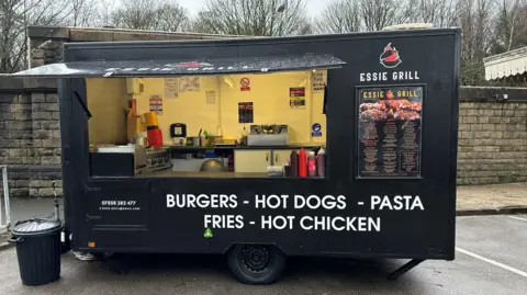 Ismail Rammo Food trailer in a railway station car park offering burgers, hot dogs and pasta etc