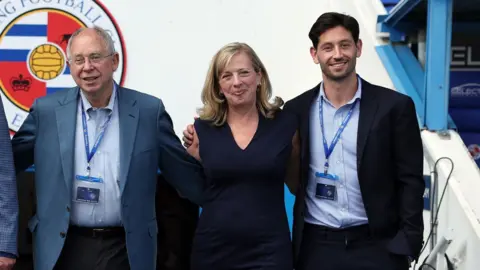 From left to right, Rob Couhig, Missy Couhig and Joe Jacobson pose for a photo